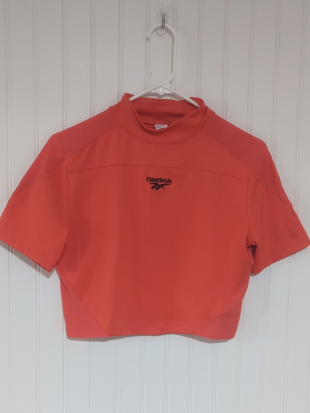 Reebok Women’s Coral-Orange Short Sleeve Crop Top